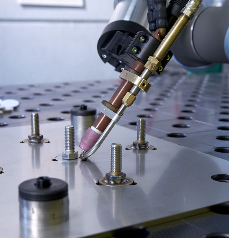 CoWelder TIG with cold wire feeder preparing to weld workpiece