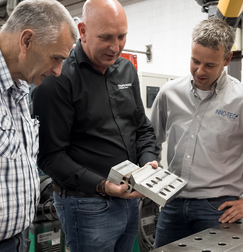 Michel Faes showing off welded workpiece